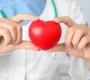 depositphotos_236302384 stock photo doctor holding red heart closeup 90x80